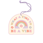 Air freshener with a rainbow and flowers in pastel colors that say "What A Time To Be A Vibe."