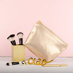 Tweedle Dum Metallic is a cute cosmetics bag with a zippered top.