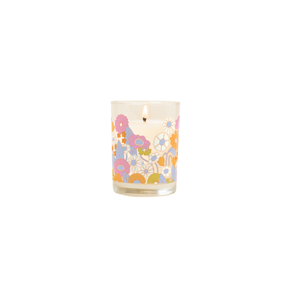 Candle rocks glass with multi-color flowers design wrapped around glass.