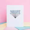 White greeting card standing open with 3d text 