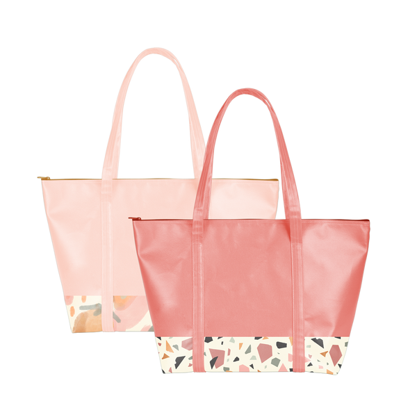 Two cute travel bags; one red with terrazzo trim and one peach with abstract fruit print trim and zippered top.