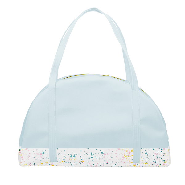 Travel tote bag in powder blue with white paint splatter detail along the bottom and double shoulder straps.