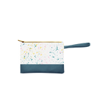 Small pouch wristlet in white with paint splatter print, and a spruce green handle and gold zipper.