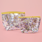 Two cute Cosmetics Bag in a clear vinyl with glitter confetti lining and a gold zippered top.