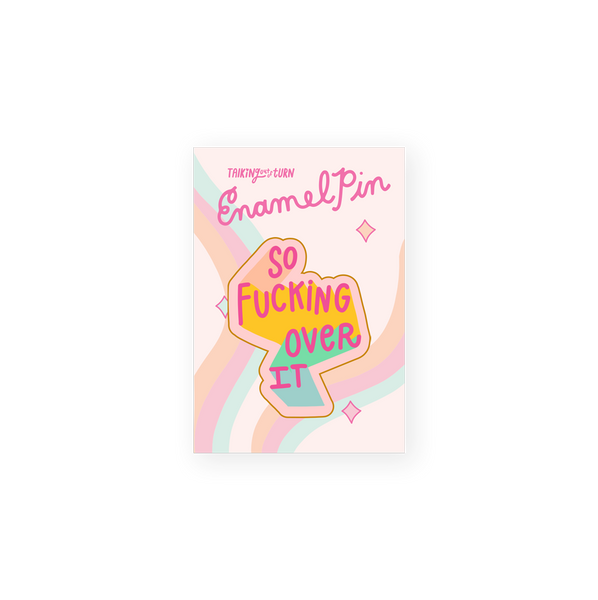 enamel pin saying so fucking over it in pink on top of bright colors