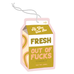 Air freshener shaped like a milk carton with "As you can see Fresh Out Of Fucks" in a groovy block print. 