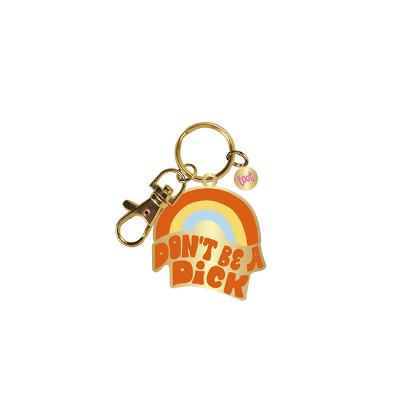 Gold key charm with groovy orange, yellow, and blue rainbow with "Don't Be A Dick" written in orange letters. 