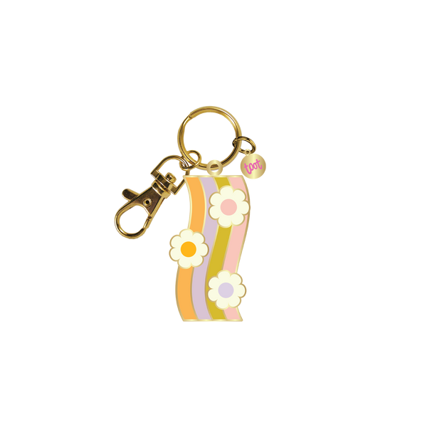 Gold key charm with wavy orange, purple, green, and pink stripes with with flowers with colored center.