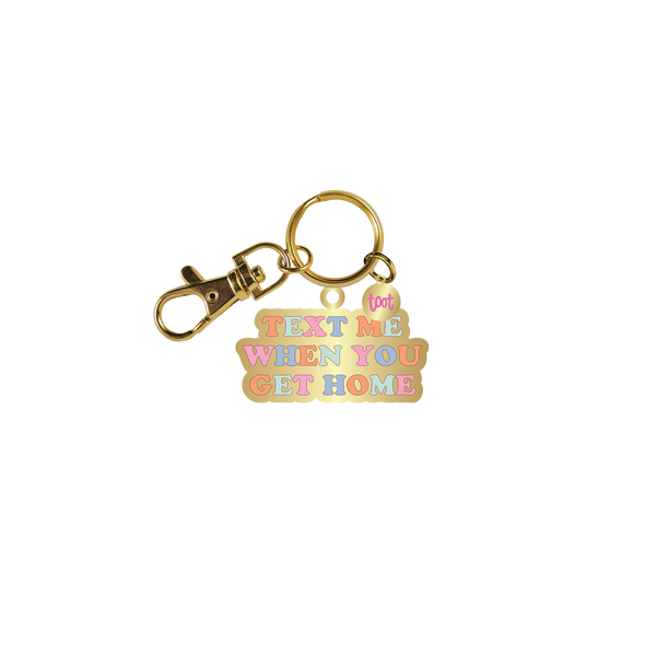 Gold key charm with colorful "Text me when you get home" 