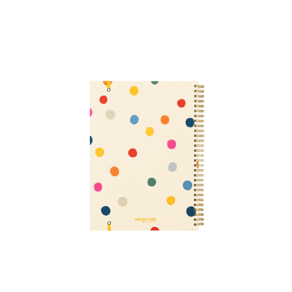 Back cover of a fun spiral bound notebook with polkadots in a bunch of colors.