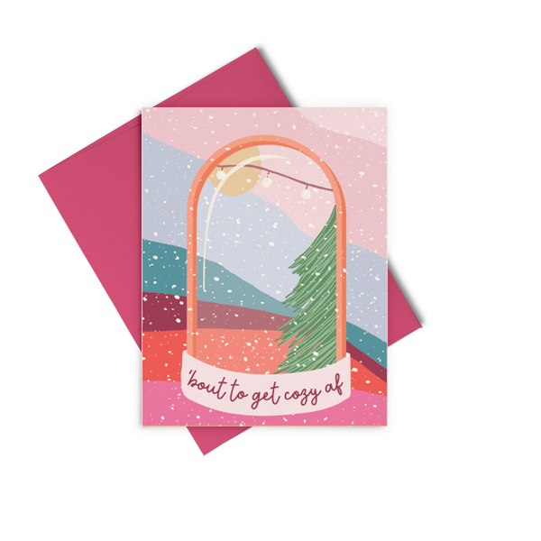 A multicolored holiday greeting card with a tall snow globe that reads "'bout to get cozy af"