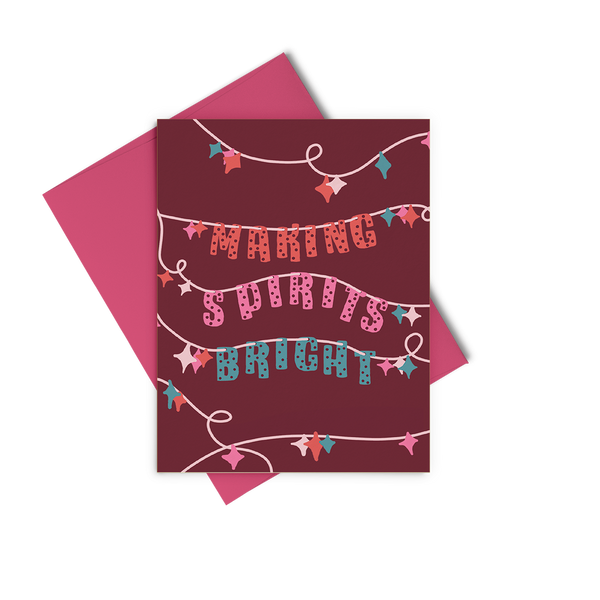 A dark red greeting card with string lights in teal, pinks, and red, and "making spirits bright"