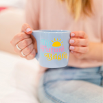 Cornflower blue mug with saying "the future is bright"