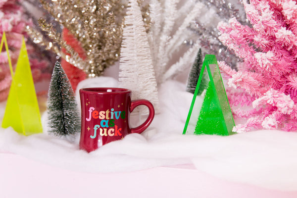 Red Mug with text "Festive as Fuck" in multicolored letters 