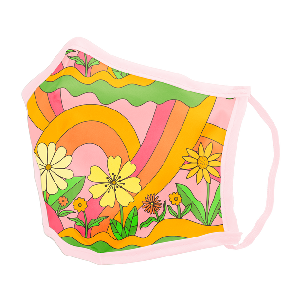 A groovy inspired face mask with rainbow arches, curvy lines, and differently designed flowers. Colors of the mask are pink, orange, green, and yellow with a light pink trim.