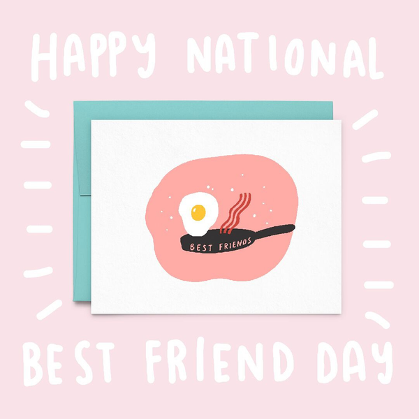 A white greeting card with a fried egg and a slice of back on a black skillet with the text "Best Friends". The image background is light pink with the text "Happy National Best Friend Day".