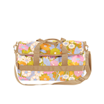 Barrel shaped tote with multi color flowers "gatherin flowers" print on it; beige nylon shoulder strap and short carrying handles.