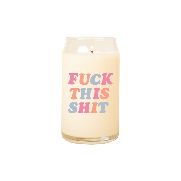 A 16 oz. candle with Fuck This Shit printed on in multicolored lettering.