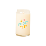 A 16 oz. candle with "Is it Friday?" printed on in multicolored lettering.