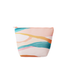An abstract, hill-like designed pouch in pastels. Pouch is a large, puffed-trapezoid shape with a peach colored zipper.