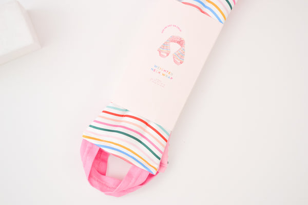 rainbow striped neck wrap with pink handles in's cute packaging