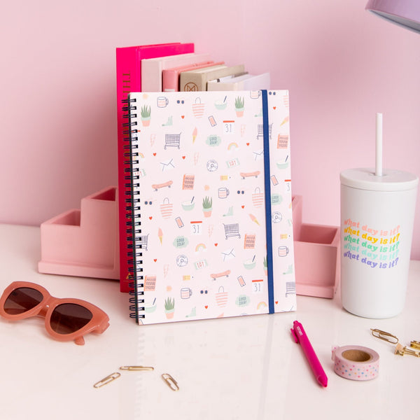 Lucky Charms Notebooks with icon doodles and Blue elastic closure. White, What Day Is It 16oz Cold Cup and Pink Jotter Pen