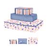 small, medium, and large packing cube set. One with magic sprigs print, one periwinkle, and one with purple and blue stripes