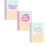 A plain background with 3 mini notebooks. One that says "exhale the bullshit" in purple, one says "shit show" in pink and "cluster fuck" in blue. 