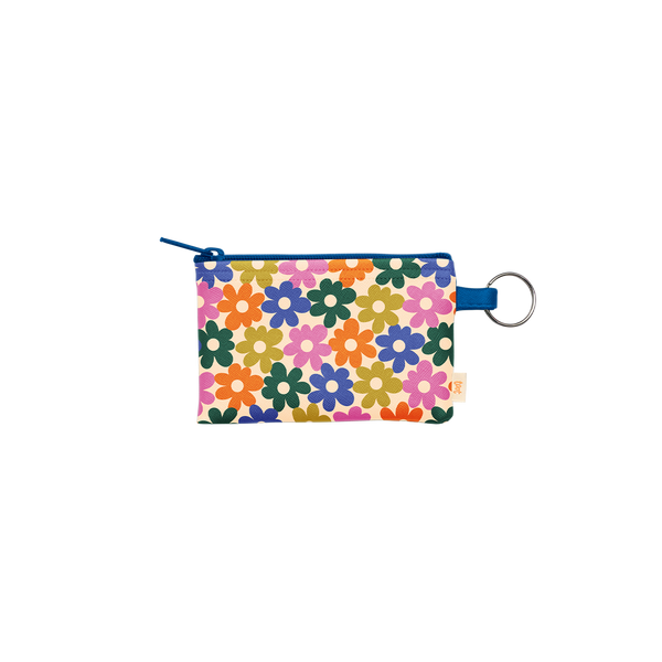 Colorful floral print zippered pouch with key ring and dark blue zipper, featuring multicolored flowers. 
