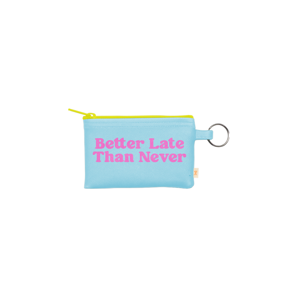 This penny key ring is a super functional way to hold all your valuables while on the go!! This playful penny key ring is made of vegan leather and features a zippered closure. The main color is turquoise with a bright yellow zipper  zipper and Better Late Than Never" is written in bright pink.