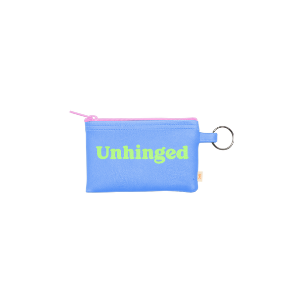 This penny key ring is a super functional way to hold all your valuables while on the go!! This playful penny key ring is made of vegan leather and features a zippered closure. The main color is light blue with a pink zipper and word "Unhinged" is written in green.