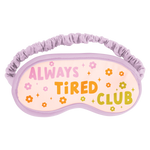 Sleep Mask with "Always Tired Club" surrounded by pink, orange, and green flowers and sparkles with a boarding lilac rim.