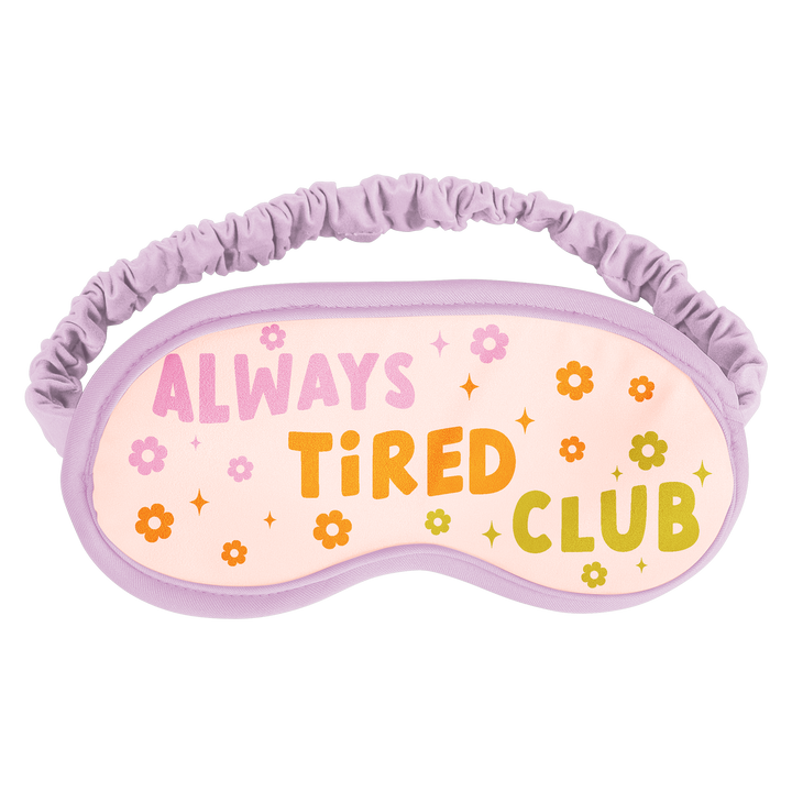 Sleep Mask with "Always Tired Club" surrounded by pink, orange, and green flowers and sparkles with a boarding lilac rim.