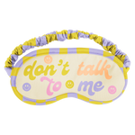 Colorful "dont talk to me" text on a soft microfiber sleeping mask with smiley faces and a lilac and green check around 