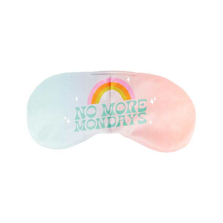 A picture of one cute, dreamy eyemask with gradient of light blue to blush pink, with the saying ""No More Mondays"