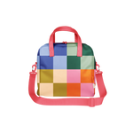Bold and colorful checkered bag with a grid pattern in vibrant hues of blue, pink, green, orange, yellow, and cream. Features bright coral pink handles and a matching adjustable shoulder strap—perfect for roller skates, gym essentials, or making a fun retro fashion statement.