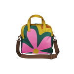 Colorful bag with a large pink flower design and brown strap. Made from vegan leather with a canvas liner.