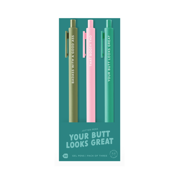 A trio of gel jotter pens on teal packaging labeled “YOUR BUTT LOOKS GREAT.” The olive green pen says “BADASS WITH A GOOD ASS,” the light pink pen reads “THAT BOOTY THO,” and the teal green pen says “YOUR BUTT LOOKS GREAT.” Packaging indicates it’s a gel pen pack of three with ink that matches the barrel color.