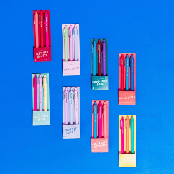 A collage of three pack gel jotter sets. Each of the jotter sets are a different color and feature a different saying on the jotter. The jotter's are .5mm and write in ink that matches the barrel.