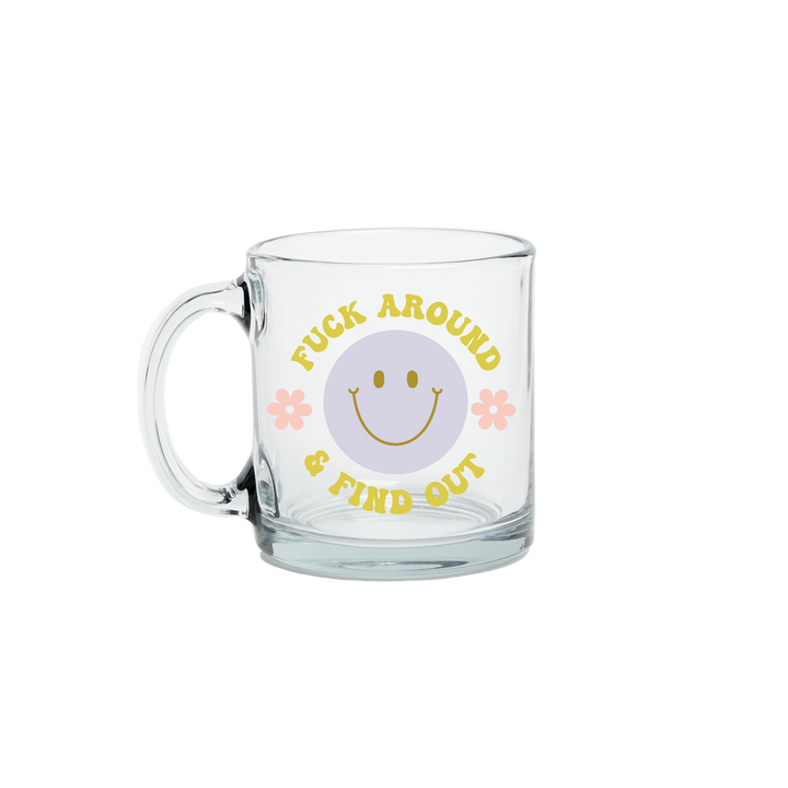 Citron "fuck around and find out" text glass mug with a blue smiley face and small daisys on the each side