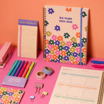 Colorful 2025-2026 Toot academic planner with a floral design surrounded by cute Toot jotters and other Toot products
