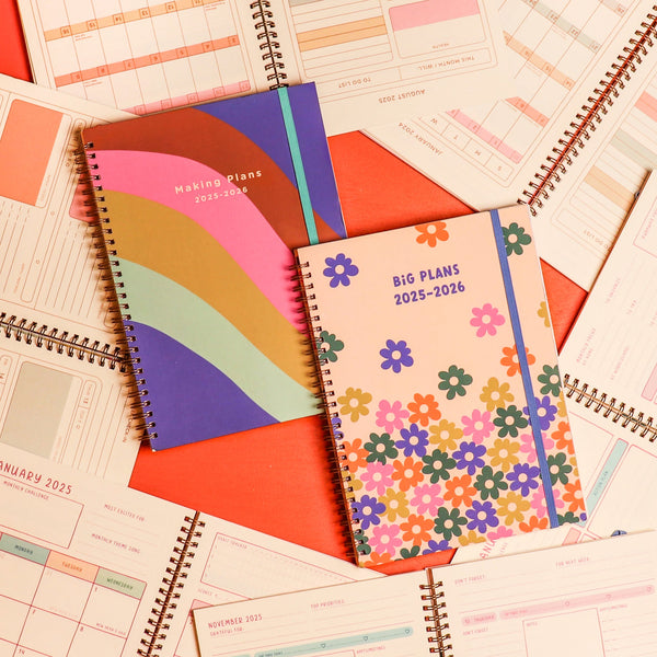 Colorful 2025-2026 Toot academic planners one floral design one with a rainbow wave surrounded by academic planner guts
