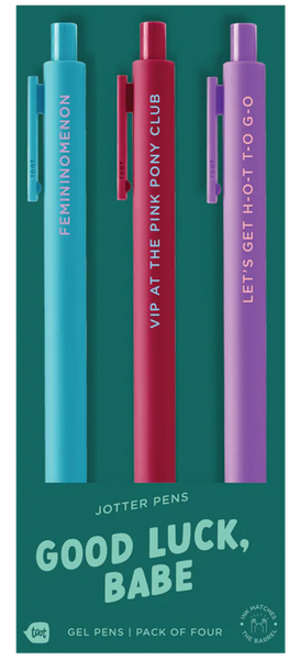 "Good Luck, Babe" jotter pens — a vibrant pack of three gel pens featuring bold phrases: “FEMININOMENON,” “VIP AT THE PINK PONY CLUB,” and “LET’S GET H-O-T T-O-G-O,” with matching ink and barrel colors in teal, red, and purple.