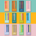 Colorful collection of 12 Toot Jotters gel pen sets, each pack of three featuring playful and expressive quotes like “DON’T BE A DICK,” “JUST BREATHE,” “SCHOOLIN’,” “WORK MOOD,” and more — vibrant jotter pens designed for personality-packed writing with matching ink and barrel colors.