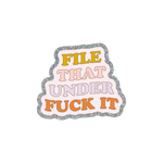 This sticker has the phrase "FILE THAT UNDER FUCK IT" displayed in a stacked layout. There is a silver glitter boarder with a very light lavender background. The words are each in a different color. FILE is in a mustard yellow, THAT is in pink, UNDER is in lavender and FUCK IT is in orange.