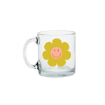 Clear glass mug with a smiley green flower.