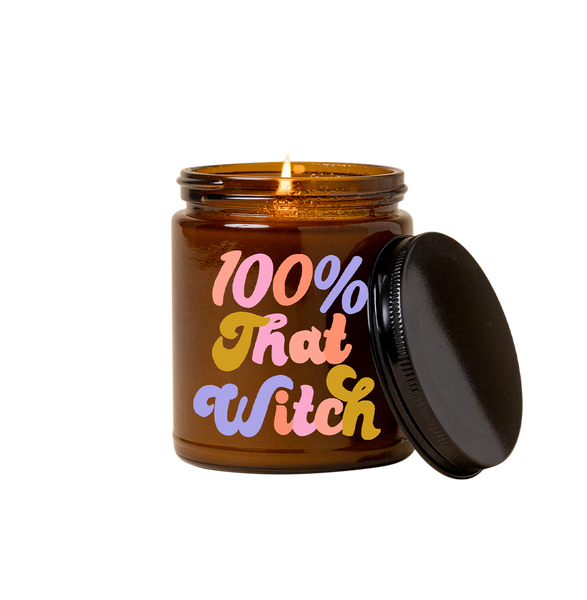 Halloween Candle amber jar with lid with saying "100% that witch" in shades of pink, purple and orange