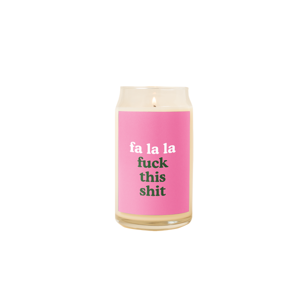 Holiday candle with pink decal that says,"fa la la fuck this shit"
