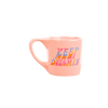 Peach mug which says keep dreamin'