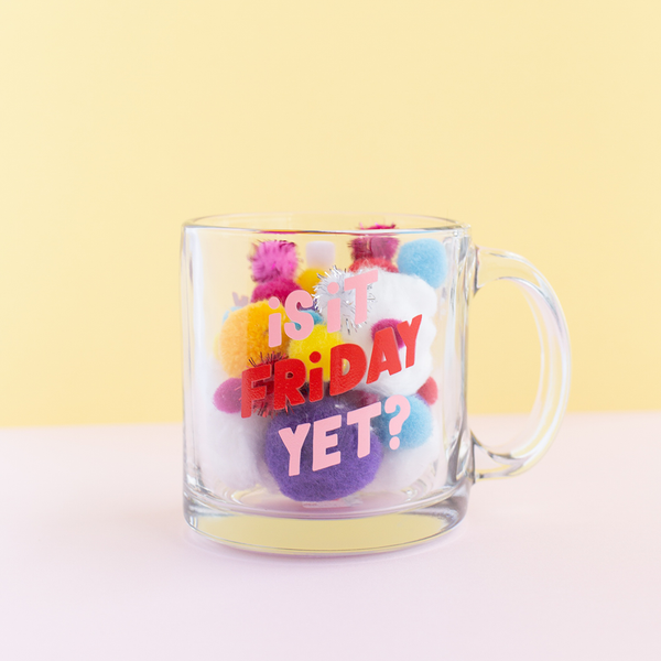 Is it Friday Yet? Glass Mug is a funny coffee mug in pinks and red filled with colorful pom poms